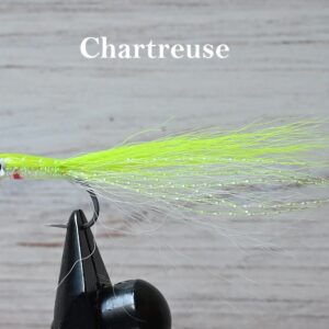 Close-up of a Chartreuse fishing fly tied on a hook.