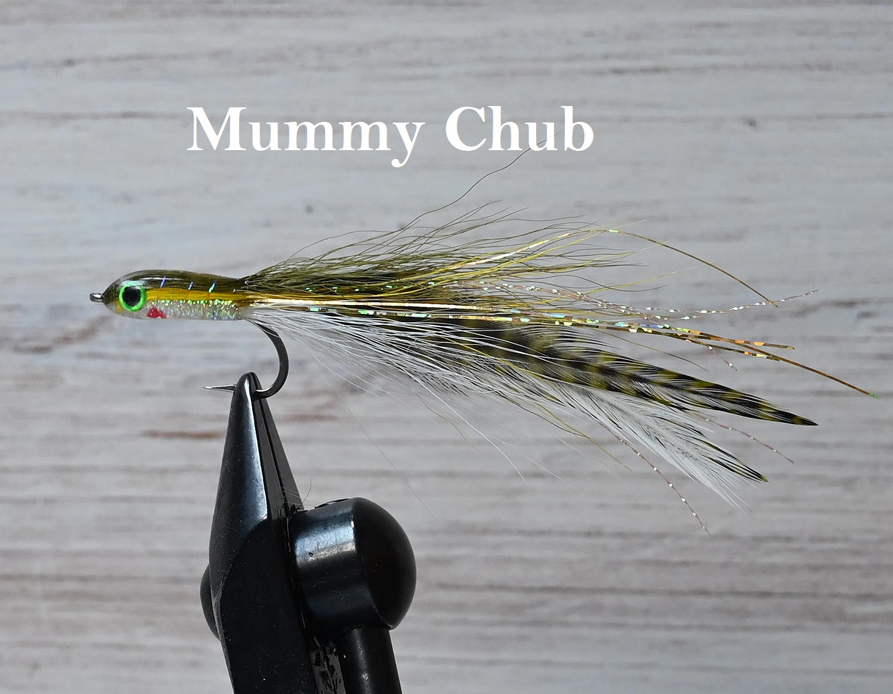 Close-up of a Mummy Chub fishing fly tied on a hook.