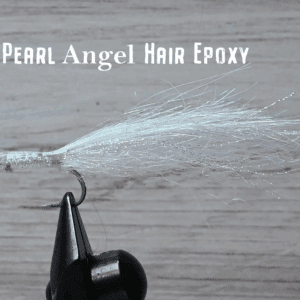 Close-up of a Pearl Angel Hair Epoxy fly tying material on a hook.